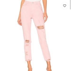 Fara Distressed denim pants in pink from Revolve